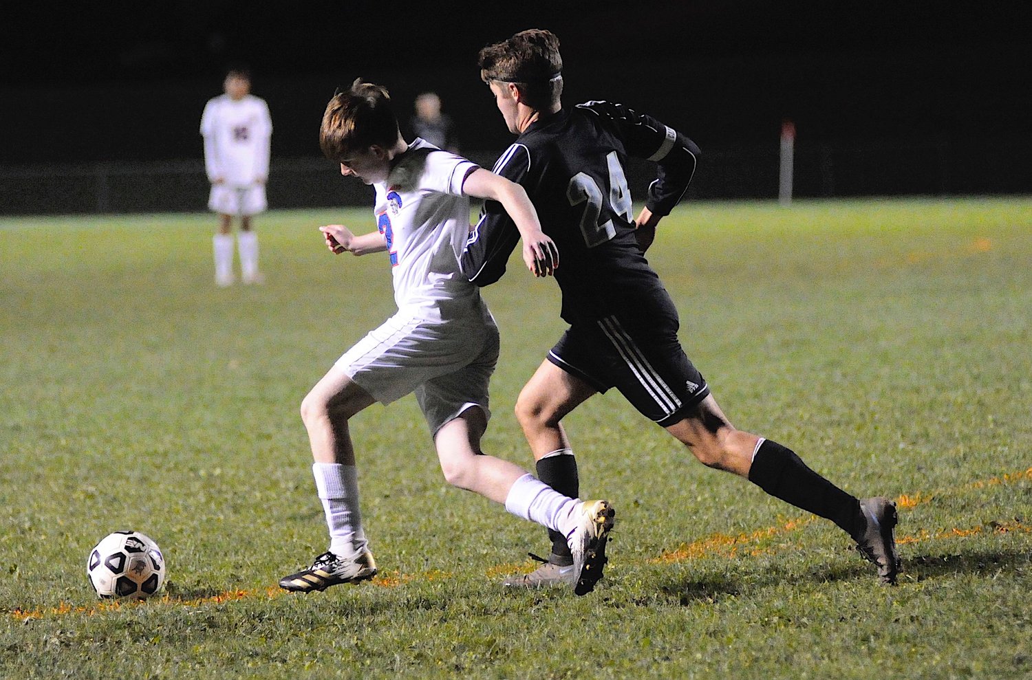 One-on-one. Seward’s Tim Raines advances the ball, as Sullivan West’s co-captain Dylan Sager closes in on the action.